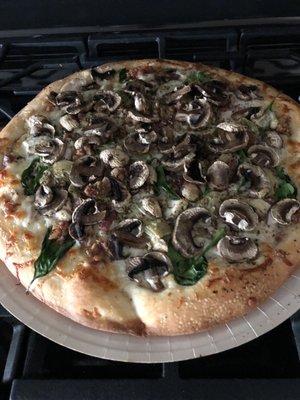 Cooked  chicken bacon artichoke regular crust with added mushrooms.