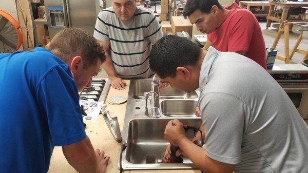 Our class repairing scratches in a stainless steel sink.