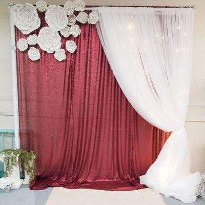 Maroon Sequin Backdrop with White Sheers and White Foam Flowers