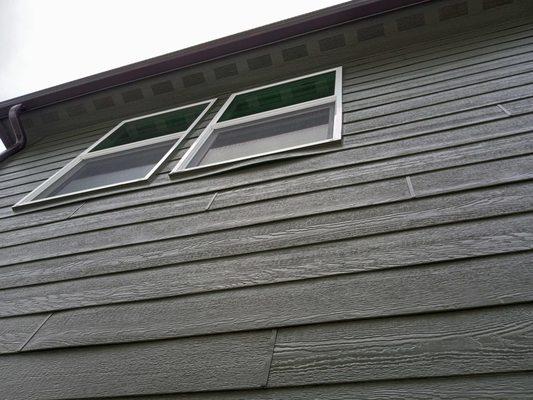 example of bowed siding seen throughout neighborhood