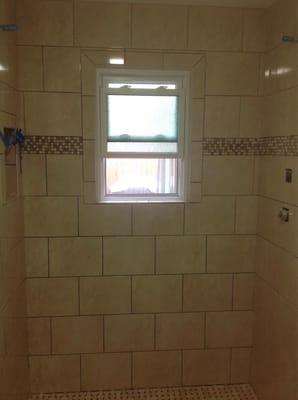 This is our shower after we had another awesome contractor come in and try to fix the many many errors Mike made in our tile.