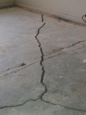 Underneath the carpet cracked foundation