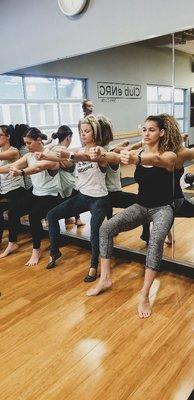 Wall sits every class, great for upper thighs and core strength