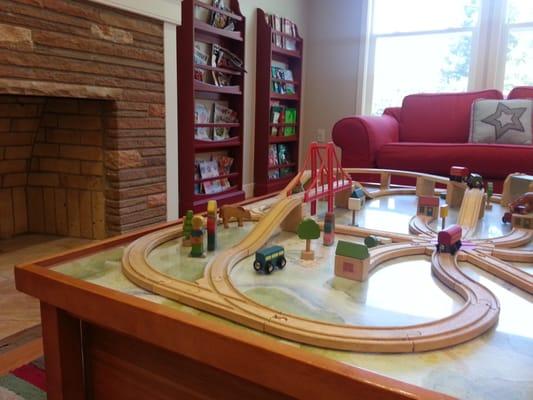 Train table, books, Toys & drawing desk to keep your little one occupied while waiting.