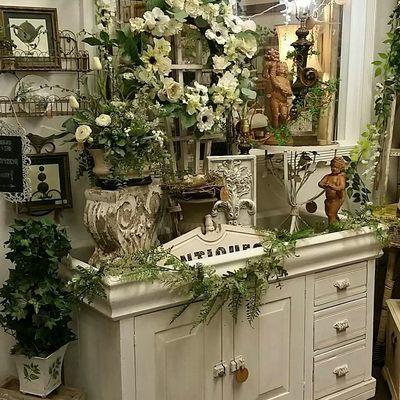 This is an old dry sink that can be used as a potting bench,below a TV, a coffee bar...etc! Don't you just love all of the garden decor?