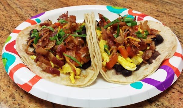 Breakfast Taco  Black beans, scrambled eggs, bacon, pico de gallo & cheese