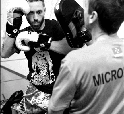 Coach John demos during Pad and Clinch class