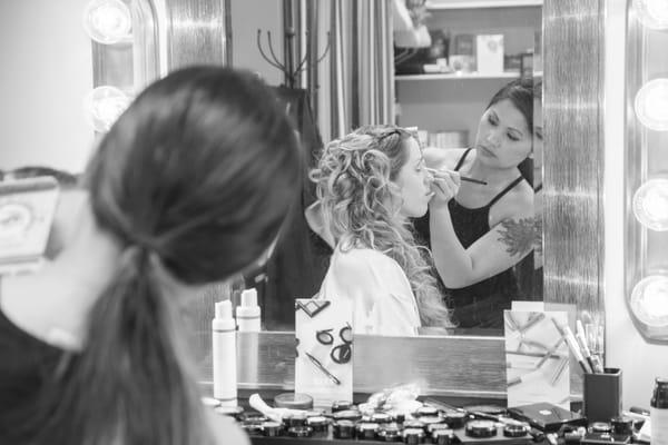 Kat working on the bride's make up