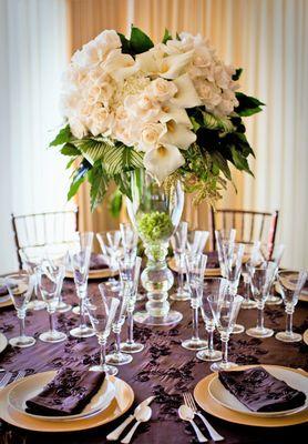 Exclusive creamy white elevated wedding centerpiece. Calla lilies, roses, hydrangea