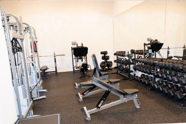 Gym space - racks, free weights, leg press, benches.