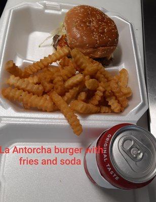 La Antorcha burger with fries and soda