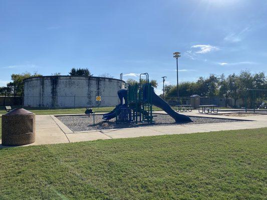 Smaller kid's playground with picnic benches