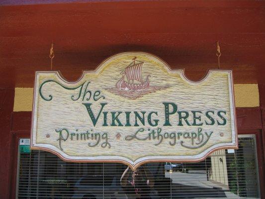 Our original hand-carved sign made in 1974 still hangs