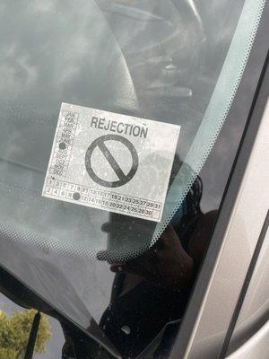 Rejection sticker. The car failed inspection.