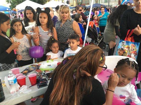 Face painting on Bellflower Boulevard