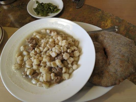 Hominy with lamb meat with fried blue corn flat bread. So good!