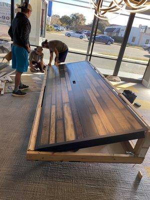 Unboxing this conference room table before they put it together.