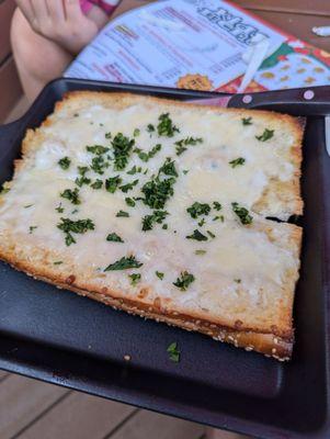 Garlic bread appetizer, $2 off during happy hour