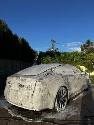 Here's a beautiful picture of a Ludicrous Model S Tesla Getting a deep clean of the exterior!