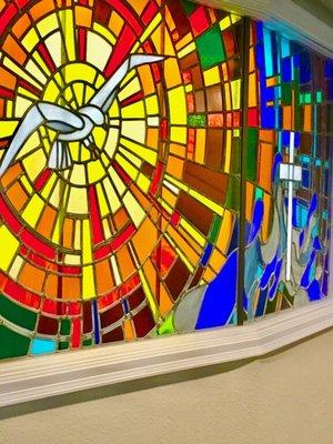 Distinctive and brilliant stain glass art in our gathering space