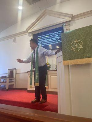 Rev Jin Bae preaches using the new TV screen in the chapel.