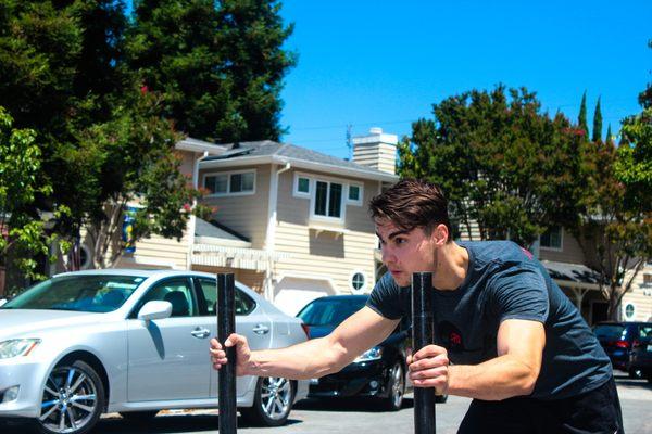 Roman working on speed with some sled pushing