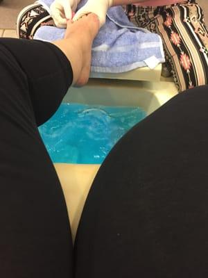 Pedicure in massage chair