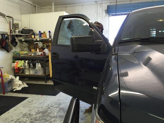 Joseph working on the passenger side window.