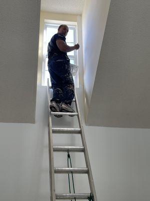 Me on the ladder doing the front room