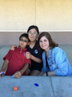 The principal with a couple of international students.