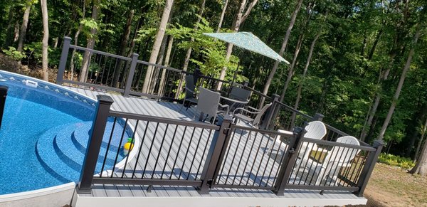 Semi wrap around composite deck with black composite railings done by the pros at County Home Improvements LLC!