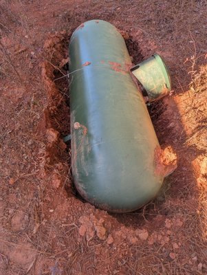 Tank float out of the ground. Should be underground was buried.