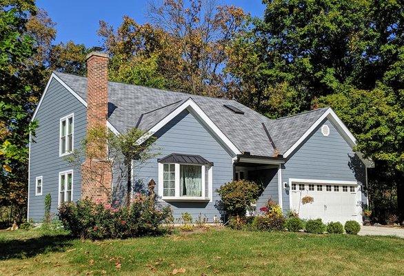 James Hardie fiber cement siding, Atlas Stormmaster Slate roof, Black seamless gutters.