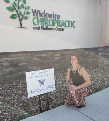 Sarah outside of the office at Wickwire Chriopractic and Wellness Center in Cedar Rapids