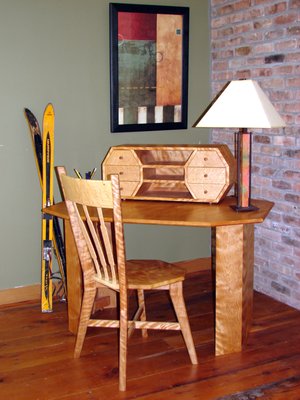 Writing desk in curly red birch and bird's-eye maple