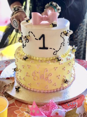 A custom made 1st BEE-day cake!!  Beautiful custom job with monogram, bees, #1, and delicate colors.