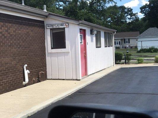 Allergy office is around back and located in the basement. The front office is a pediatric office.