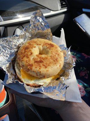 Sausage egg and cheese on an Asiago bagel