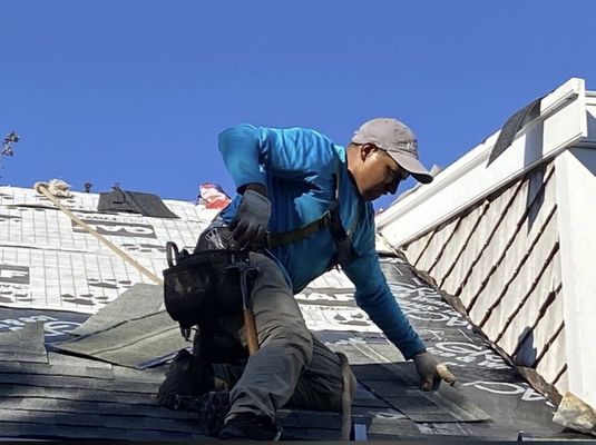 Luis working on installing a new 50 Year Roof