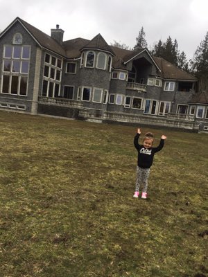 My daughter in the back yard of the castle.