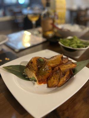 Avocado Bomb (spicy tuna inside served with sweet potato chips)