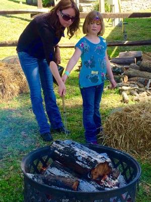 Roasting s'mores over an open pit-2016