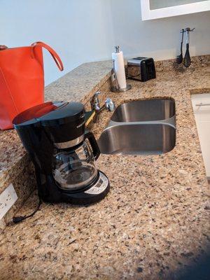 The coffee maker and sink