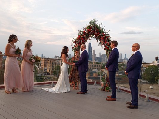 Renewing wedding vows with high views of the city and a drone recording the ceremony