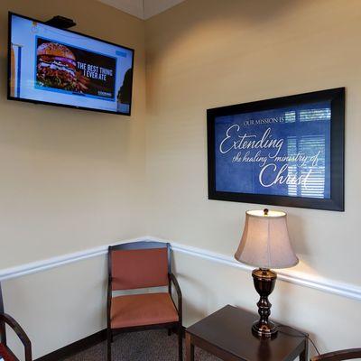 Employer's Care Room.  Separate from Waiting Room with door to close for staff. Is that cool or what?!