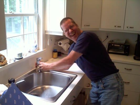 Kenny repairing a faucet