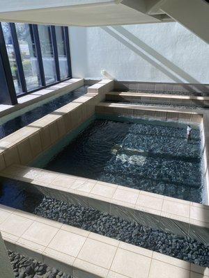 Water feature and waterfall in the first floor lobby.  The sound is relaxing and soothing.