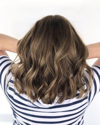 Balayage and foils to create a dimensional brunette