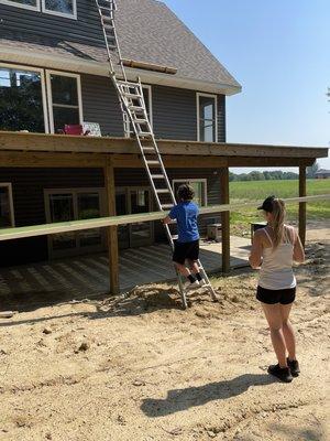 Son and his mother working hard Family first