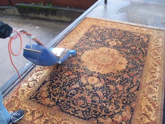 This rug was heavily soiled before we began our Professional Cleaning Package.